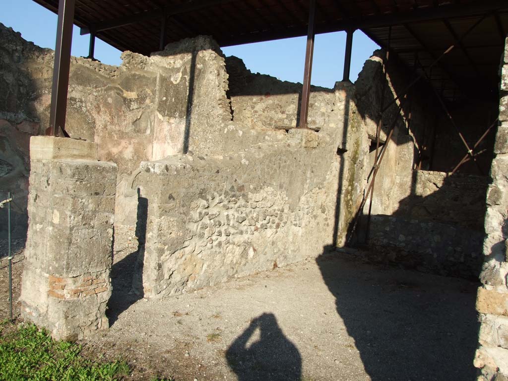 HGW24 Pompeii. December 2006. 
Looking east into room (oecus or triclinium, on right) with doorway to room at rear leading to front peristyle. 
On the left is an exedra, linked to the oecus/triclinium by a small doorway.
(Villa Diomedes Project – area 36, on left, linked by small doorway to area 19, centre right.)
(Fontaine, 4,4 on left, linked by small doorway to 4,5 in centre, and on right being where no.20, and 21 are described on La Vega plan - (at the rear of 4,5).
