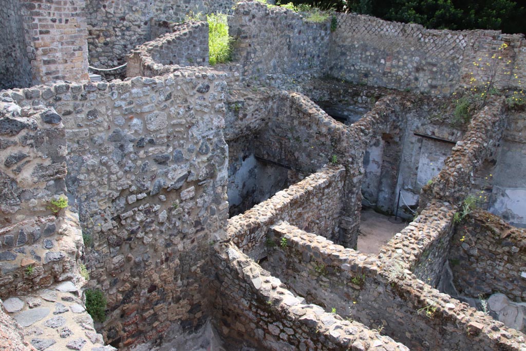 HGW24 Pompeii. Villa of Diomedes. May 2024. 
Looking towards east end of lower area to south of terrace, with corridor 5.3, lower right. Photo courtesy of Klaus Heese.