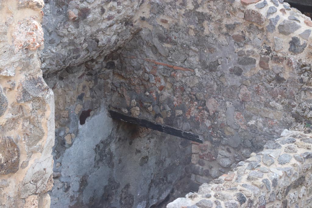 HGW24 Pompeii. Villa of Diomedes. October 2023. 
Looking south-east towards corridor at side of steps, leading to room on south side of lower area. Photo courtesy of Klaus Heese.