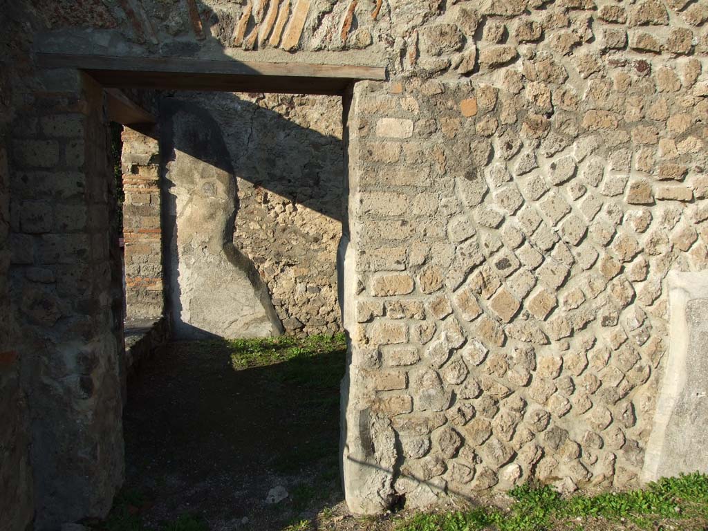 HGW24 Pompeii. December 2006. 
Doorway to room (diaeta, or garden room) at north end of terrace. (see No.4 below, on the plan by La Vega).
According to PAH, this room’s walls were painted yellow, and the floor was simple polished white mosaic.
The paintings that decorated the walls (of both rooms 3 and 4 (La Vega’s plan) were Views, Fruit and Birds, Satyr with Bacchante, Arianna, Narcissus, flying cupids carrying various things. Medallions with masks and views of landscape. Animals.
(Villa Diomedes Project – area 40).
(Fontaine, room 4,1, see also previous room 4,2 for paintings).