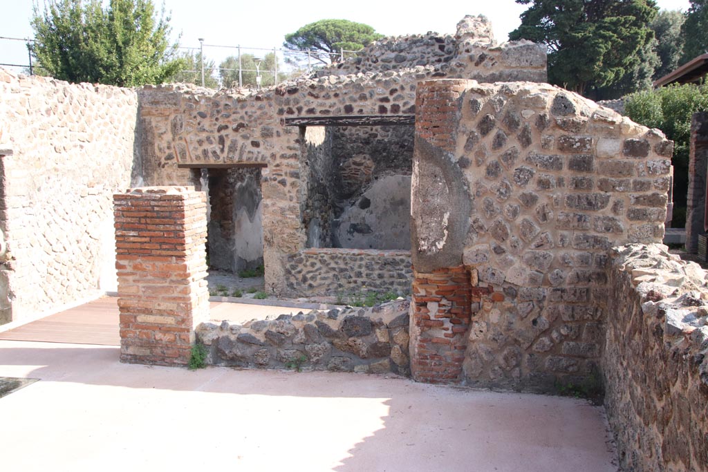 HGW24 Pompeii. Villa of Diomedes. October 2023.
Looking east across terrace A, through doorway onto terrace with doorway to corridor and window into room at north end of terrace. 
Photo courtesy of Klaus Heese.