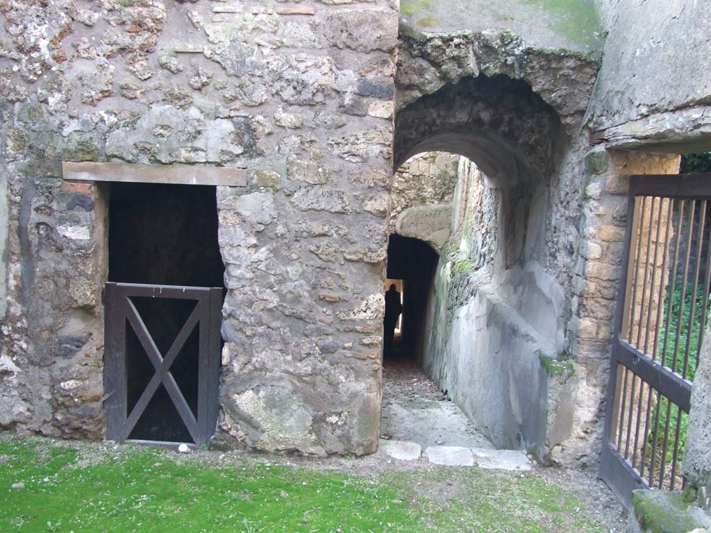 HGW24 Pompeii. December 2006. 
Corridor down to lower level. On the right is the doorway linking to the wagon entrance of HGW25.
In the room with the doorway, on left of photo, no.49 on the plan by La Vega would be found.
(Villa Diomedes Project – area 73, looking towards doorway to area 67, and corridor 62, centre right).
(Fontaine, doorway to room 5,17).