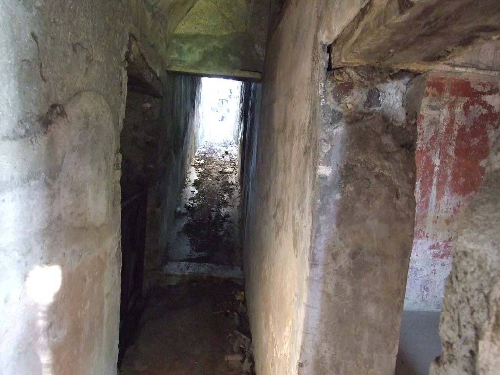 HGW24 Pompeii. December 2006. Lower level. Looking east along corridor leading to upper level. 
Doorway to room at west end of south side of corridor near east portico, on right. 
(Villa Diomedes Project – area 62 corridor, with doorway to area 61, on right).
(Fontaine, room 5,13).