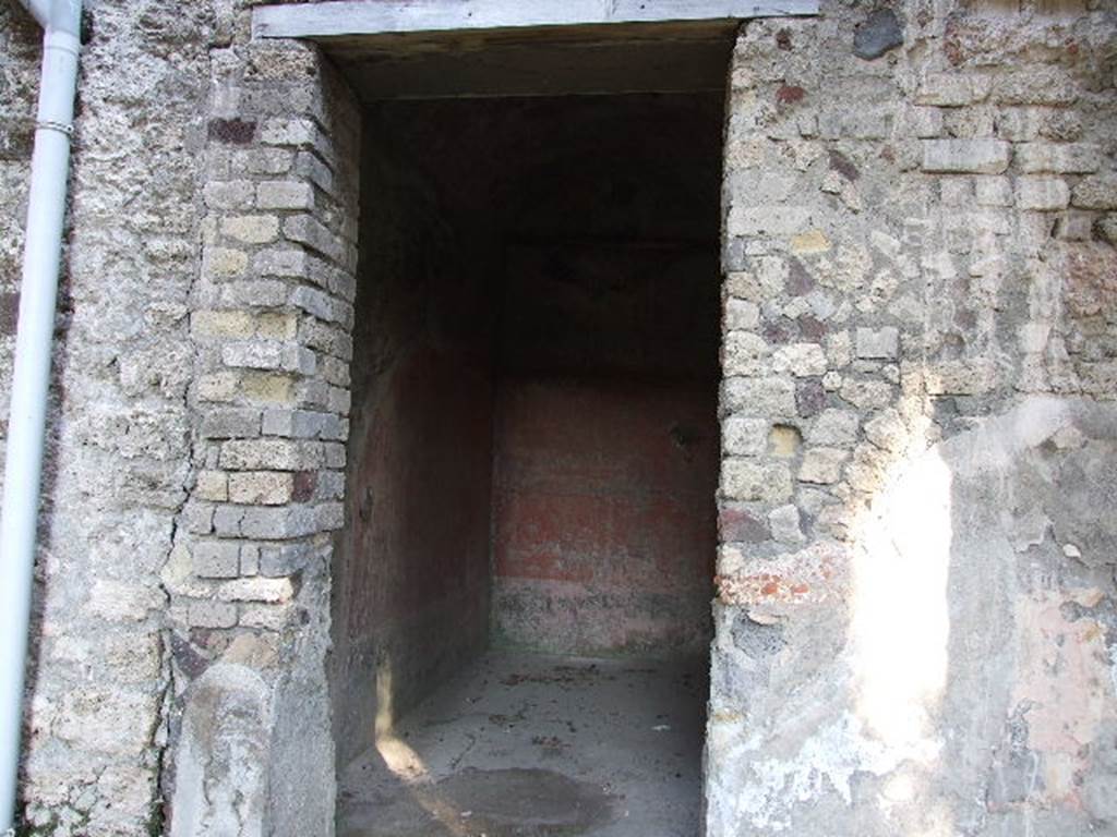 HGW24 Pompeii. December 2006.
Looking east into doorway to another one of the richly decorated living rooms on the eastern side of the garden. 
(Fontaine, room 5,8).