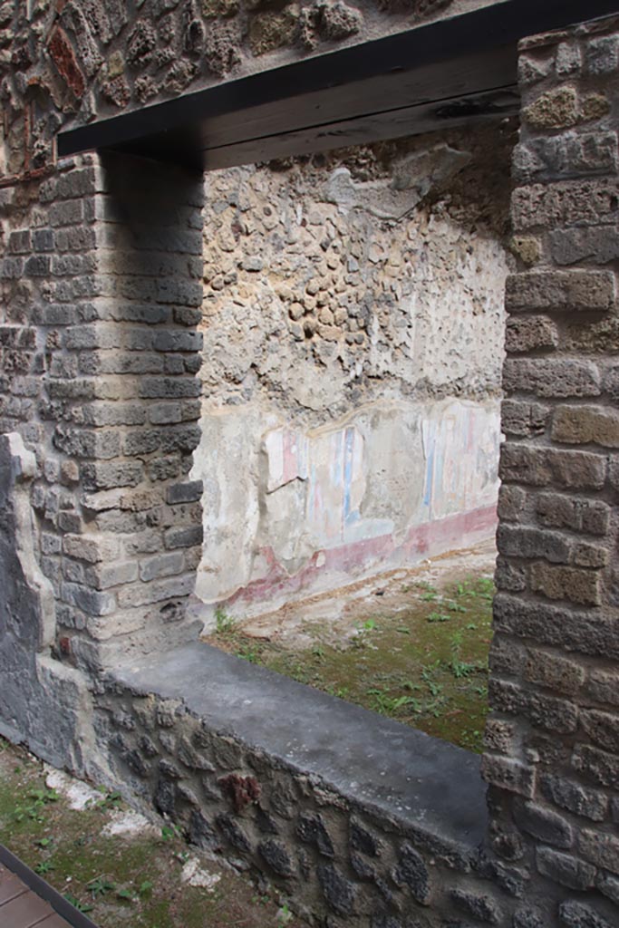 Villa of Diomedes, Pompeii. October 2023. 
Looking north-east through window from east portico. Photo courtesy of Klaus Heese.
(Villa Diomedes Project – area 53).
(Fontaine, room 5,5).