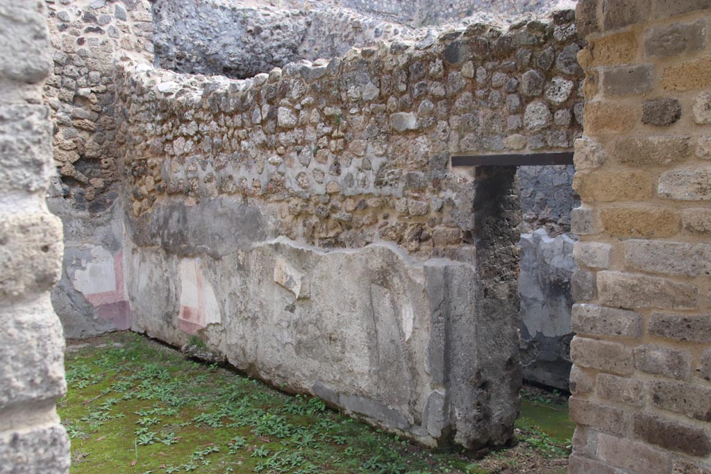 Villa of Diomedes, Pompeii. October 2023. 
Looking east along south wall with doorway to corridor, at west end. Photo courtesy of Klaus Heese.
(Villa Diomedes Project – area 53).
(Fontaine, room 5,5).