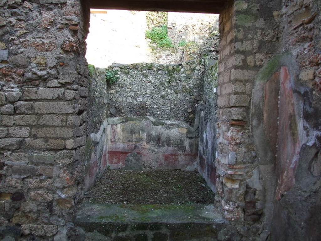 HGW24 Pompeii. December 2006. Looking east through window area into small room in south-east corner of east portico area. 
The doorway from the corridor is on the left behind the pilaster.
(Fontaine, room 5,4).