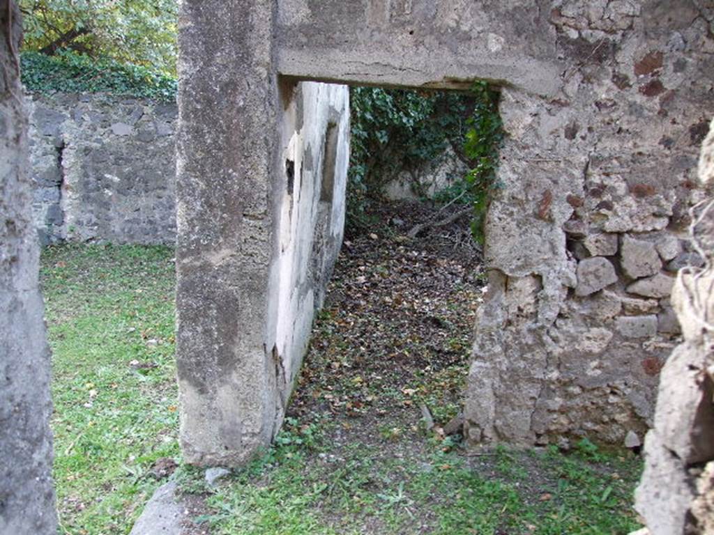 HGE12 Pompeii. December 2006. Looking west from “kitchen” across corridor to doorway to room on left side.