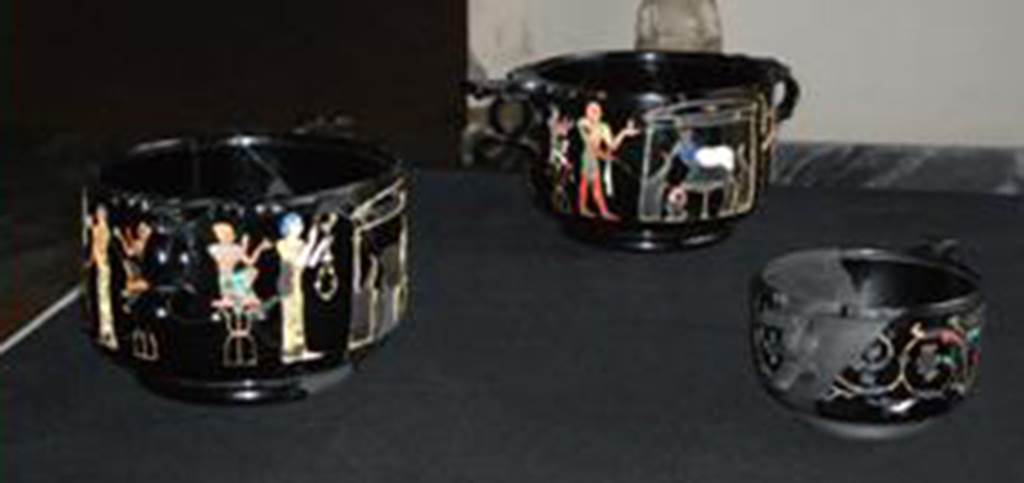 Castellammare di Stabia, Villa San Marco, Found May 1954, room 37, near the south east wall. Three obsidian Skyphii (cups) with Egyptian scenes inlaid in gold and mosaic after restoration in 2012. The shelf on which the cups were displayed had collapsed in 2011. The newspaper reports at the time said the cups were “smashed to smithereens”. Now in Naples Archaeological Museum.