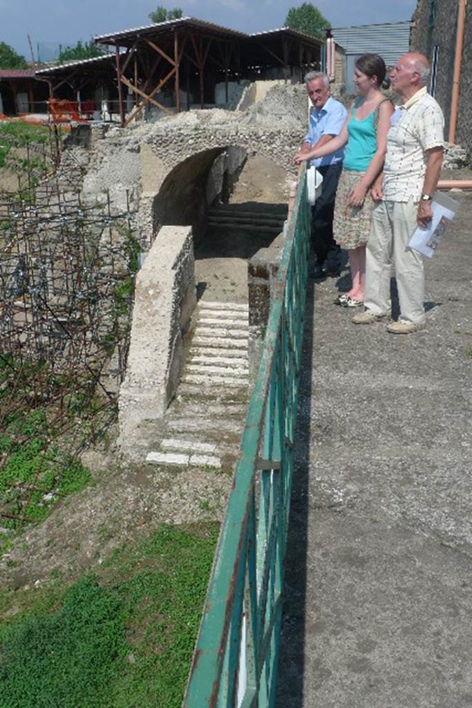 Villa San Marco, Stabiae, July 2010. 
Ancient Stabia town gate with steps at the north end of the villa.
Photo courtesy of Michael Binns.
Dell'antico abitato fortificato di Stabiae, posto su una collinetta alta circa cinquanta metri, protetto dai monti e dal mare e distrutto durante l'occupazione di Silla, il 30 aprile del 89 a.C., sono stati ritrovati pochissimi resti. Nel 1759 Karl Jakob Weber aveva parzialmente individuato e descritto parte della vecchia città che si estendeva su un'area di circa quarantacinquemila metri quadrati; in seguito, precisamente nel 1950, Libero D'Orsi, a circa trecento metri da Villa San Marco aveva riportato alla luce diversi ambienti che riconducevano a un nucleo abitativo come resti di case, botteghe, parti del macellum a cui confluivano le merci provenienti dal vicino piccolo porto e una cisterna che si affacciano su una strada basolata: si tratta con molta probabilità di edifici scampati alla distruzione sillana come dimostrano anche le decorazioni in primo stile. A oggi però questi resti sono ancora interrati e l'unica testimonianza dell'antico borgo è una porta ubicata tra villa San Marco e un'altra villa in fase di esplorazione
Translation: The ancient fortified town of Stabiae, situated on a high hill about fifty meters high, protected by the mountains and the sea, was destroyed during the siege of Sulla, on April 30, 89 BC. In 1759 Karl Weber had partially identified and described part of the old city that stretched over an area of about forty-five thousand square metres. In 1950, Libero D'Orsi, about three hundred meters from Villa San Marco had unearthed several buildings, that led back to a settlement, as remains of houses, shops, parts of the macellum through which flowed goods from the nearby small port and a tank that overlooked a paved road. He thought these were probably buildings that survived the destruction of Sulla, as demonstrated by the decorations in the first style. To date, however, these remains are still buried and the only evidence of the ancient town is a gate located between Villa San Marco and another villa still to be excavated.
See De Vos A. and M., 1982. Pompei, Ercolano, Stabia. Roma, Editori Laterza, p. 321-3.