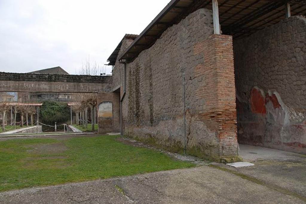 Castellammare di Stabia, Villa San Marco, January 2011. Room 16, looking across oecus towards pool 15. At the rear of the south-west wall of the oecus, on the right, can be seen the corridor, room 11. Photo courtesy of Nando Calabrese.