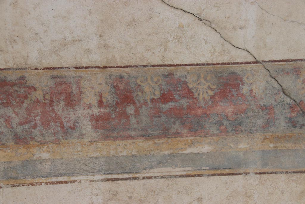 Villa San Marco, Stabiae, October 2022. 
Portico 2, detail of painted decoration from lower border on painted panel on east wall. Photo courtesy of Klaus Heese.