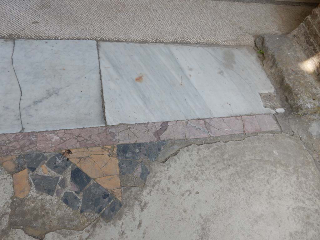 Villa San Marco, Stabiae, June 2019. Looking west at north end of doorway threshold to north portico 5, from end of pool. 
Photo courtesy of Buzz Ferebee