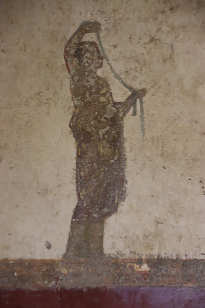 Villa San Marco, Stabiae, October 2022. 
Room 8, south-west corner of west wall, detail of figure to left of doorway into room 13.
Photo courtesy of Klaus Heese.