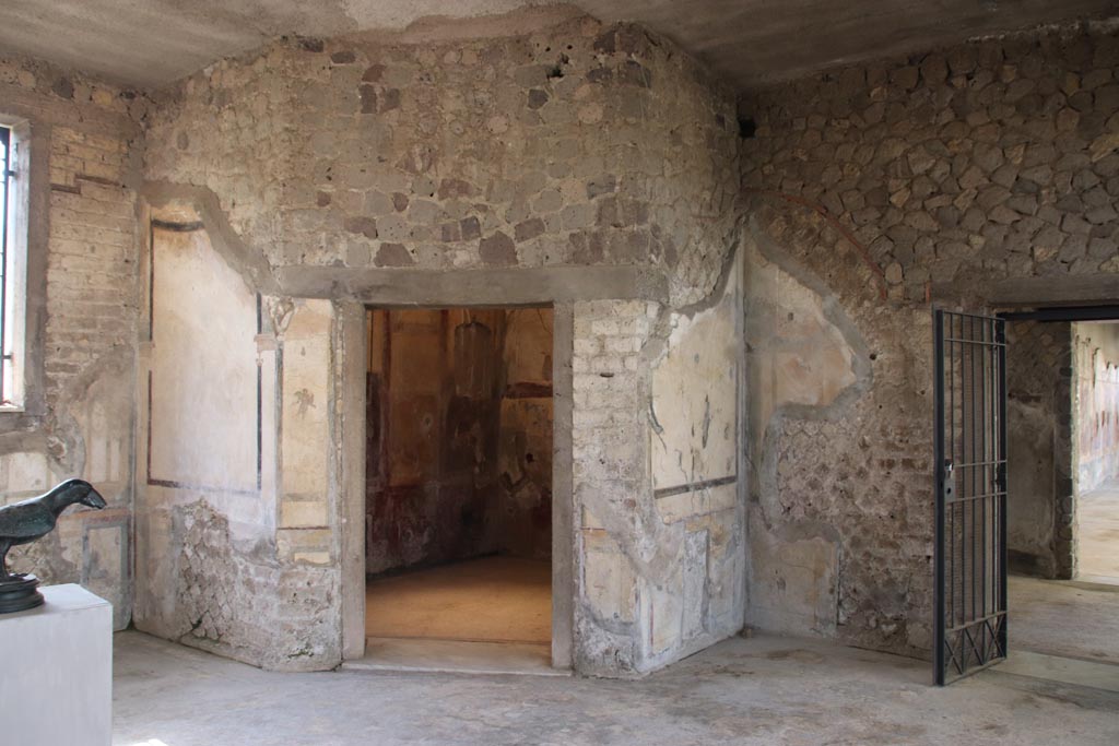 Villa San Marco, Stabiae, October 2022. Looking north.
Room 12, with doorway to room 14, in centre, and to room 8, leading to west portico, on right. Photo courtesy of Klaus Heese.