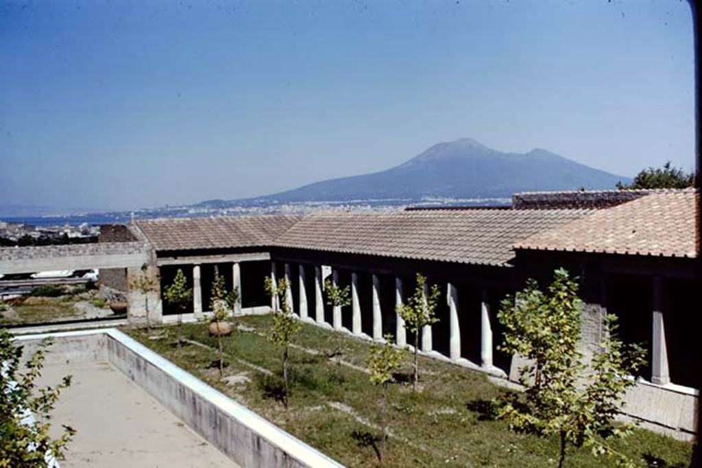 Villa San Marco, Stabiae, 1968. Looking north-east across garden area 9 over east portico 20 towards Vesuvius. 
Photo by Stanley A. Jashemski.
Source: The Wilhelmina and Stanley A. Jashemski archive in the University of Maryland Library, Special Collections (See collection page) and made available under the Creative Commons Attribution-Non Commercial License v.4. See Licence and use details.
J68f1906