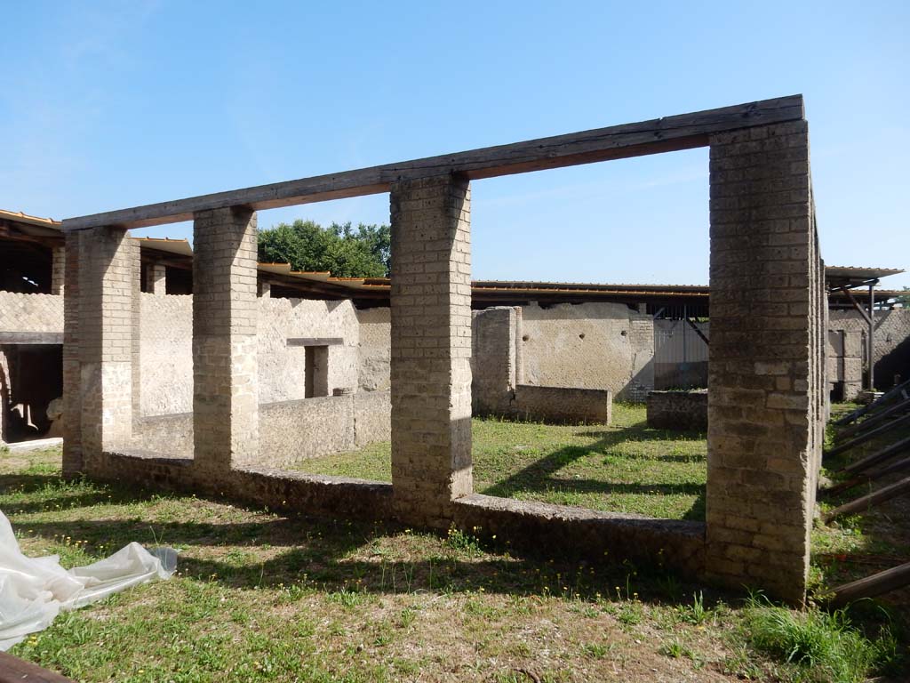 Villa San Marco, Stabiae, June 2019.
Looking from tablinum across a peristyle towards the main gateway of the Villa at its north end.
Photo courtesy of Buzz Ferebee.
According to the description on the information card –
“The inner part of the peristyle was arranged as a garden with a large central tree, as we can see from the discovery of empty spaces in the roots from which a mould has been made.”