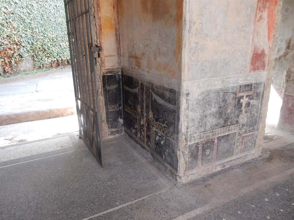 Villa San Marco, Stabiae, June 2019. Room 44, looking towards black painted zoccolo on west side of entrance doorway. 
Photo courtesy of Buzz Ferebee.