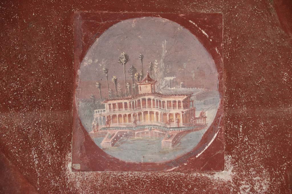 Villa San Marco, Stabiae, September 2021. 
Room 20, east wall, reproduction of medallion with a painted maritime villa. Photo courtesy of Klaus Heese.