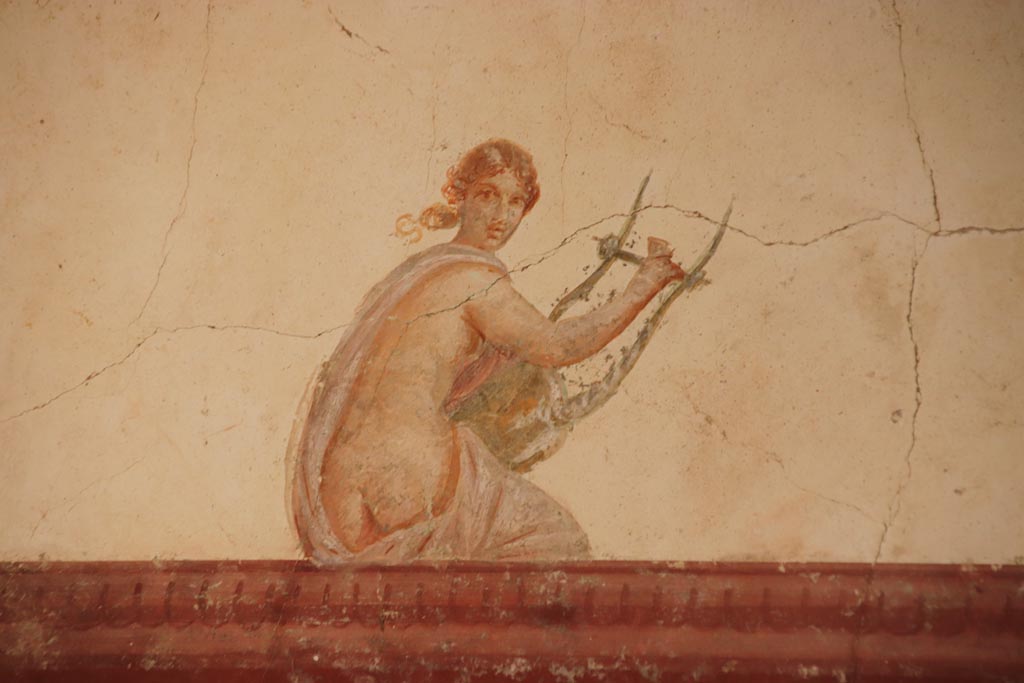Villa San Marco, October 2022. 
Room 30, painted figure with lyre from upper south wall in south-east corner. Photo courtesy of Klaus Heese.