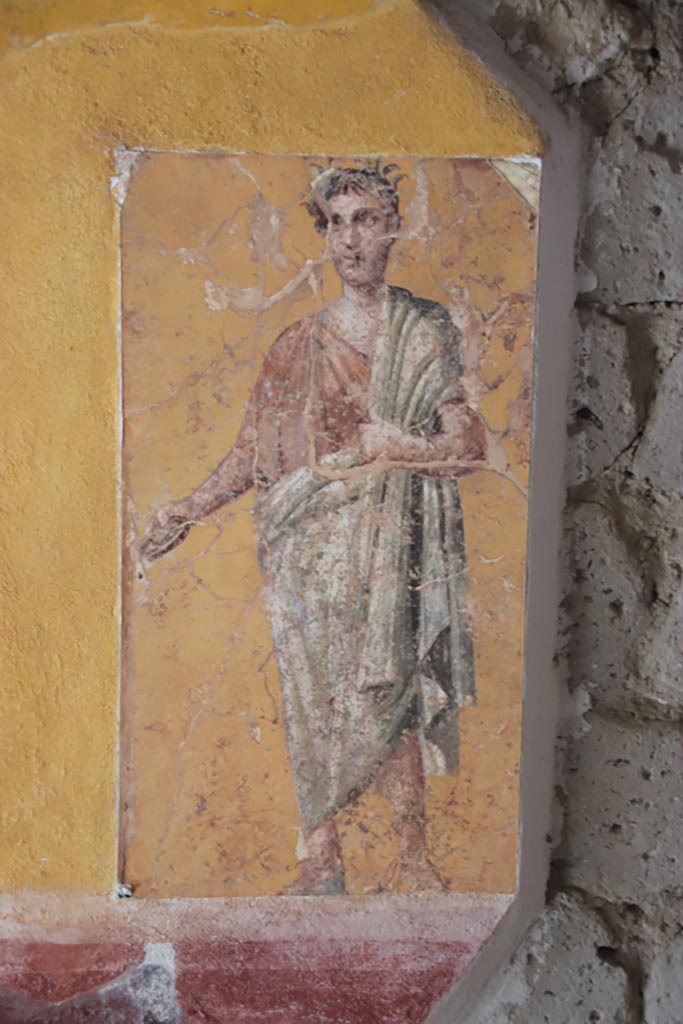 Villa San Marco, Stabiae, October 2022.  
Room 50, detail of painted figure on north wall at west end. Photo courtesy of Klaus Heese.