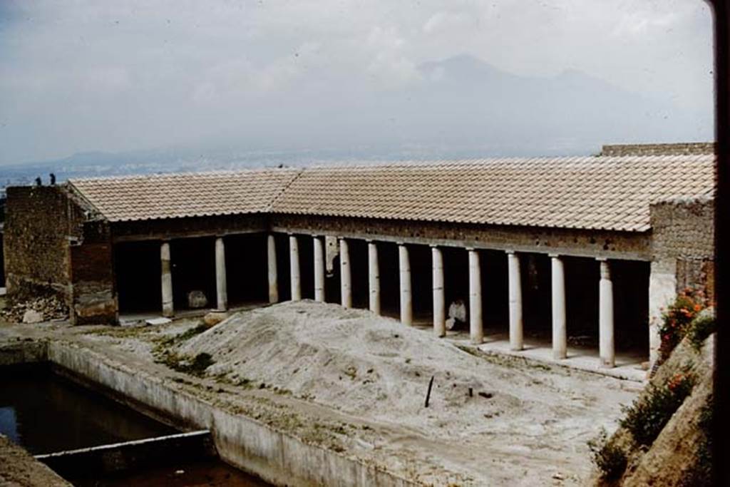 Villa San Marco, Stabiae, 1961. Looking north-east from nymphaeum across garden area and east portico during excavations, towards Vesuvius. 
Photo by Stanley A. Jashemski.
Source: The Wilhelmina and Stanley A. Jashemski archive in the University of Maryland Library, Special Collections (See collection page) and made available under the Creative Commons Attribution-Non Commercial License v.4. See Licence and use details.
Jmit0108