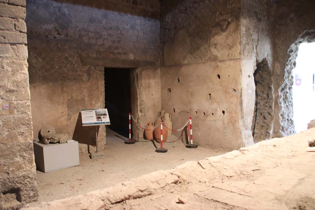 Villa San Marco, Stabiae, September 2019. 
Room 26, looking south-west across bench/hearth towards two adjacent holes made by the Bourbon excavators while tunnelling.
One leads into room 27 and one into room 20.
The doorway, left of centre, leads into room 40.  Photo courtesy of Klaus Heese.