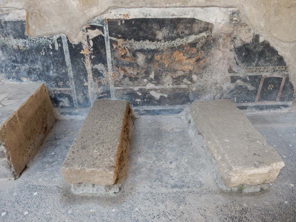 Villa San Marco, Stabiae, June 2019. Room  44, showing detail of painted zoccolo at rear of supports for the strong box on west side of atrium.
Photo courtesy of Buzz Ferebee