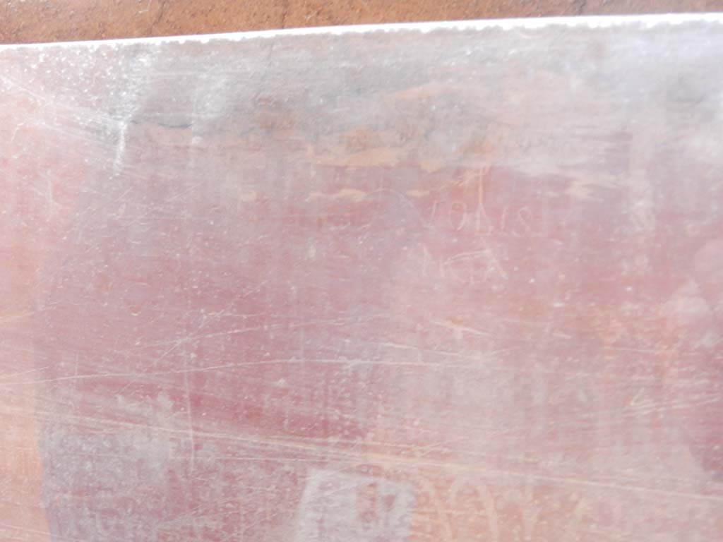 Villa San Marco, Stabiae, June 2019. Corridor 32, graffiti between second and third columns.  
Photo courtesy of Buzz Ferebee