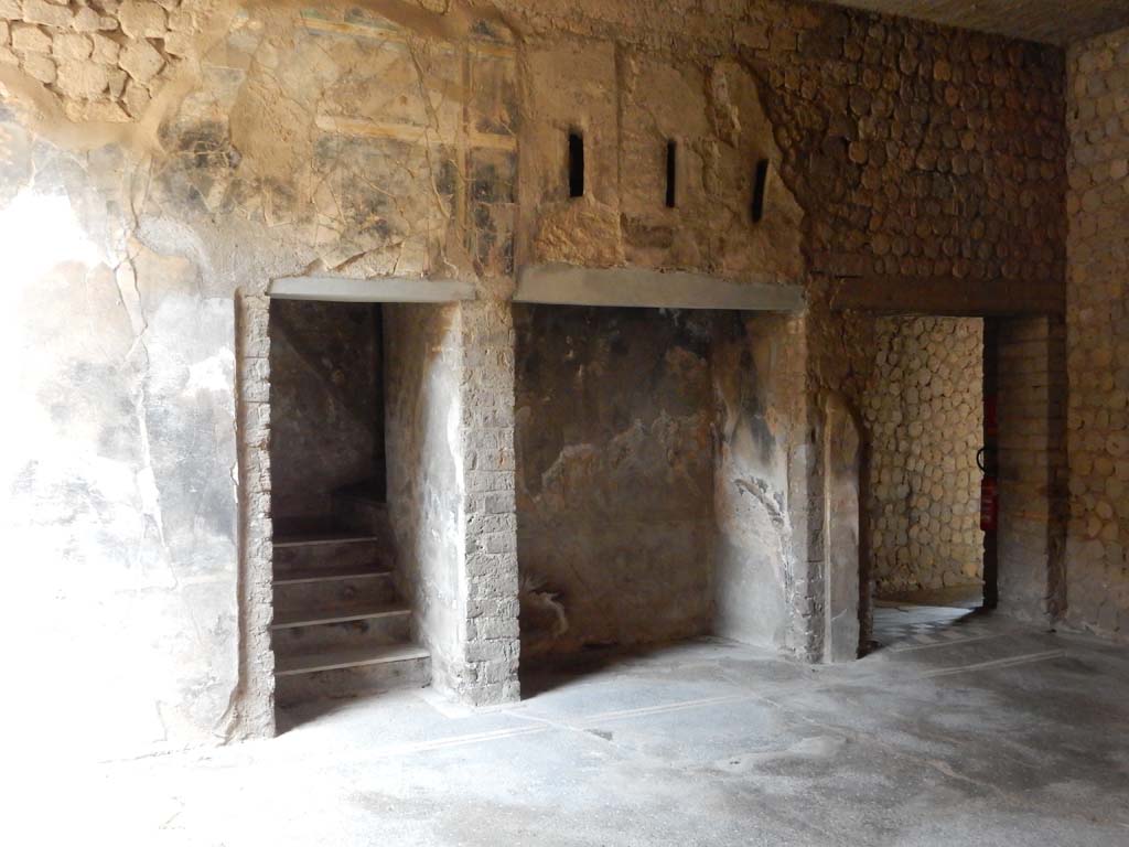 Villa San Marco, Stabiae, June 2019. Room 23, west wall with stairs to upper floor (33), alcove (34) and doorway to room 36.
Photo courtesy of Buzz Ferebee