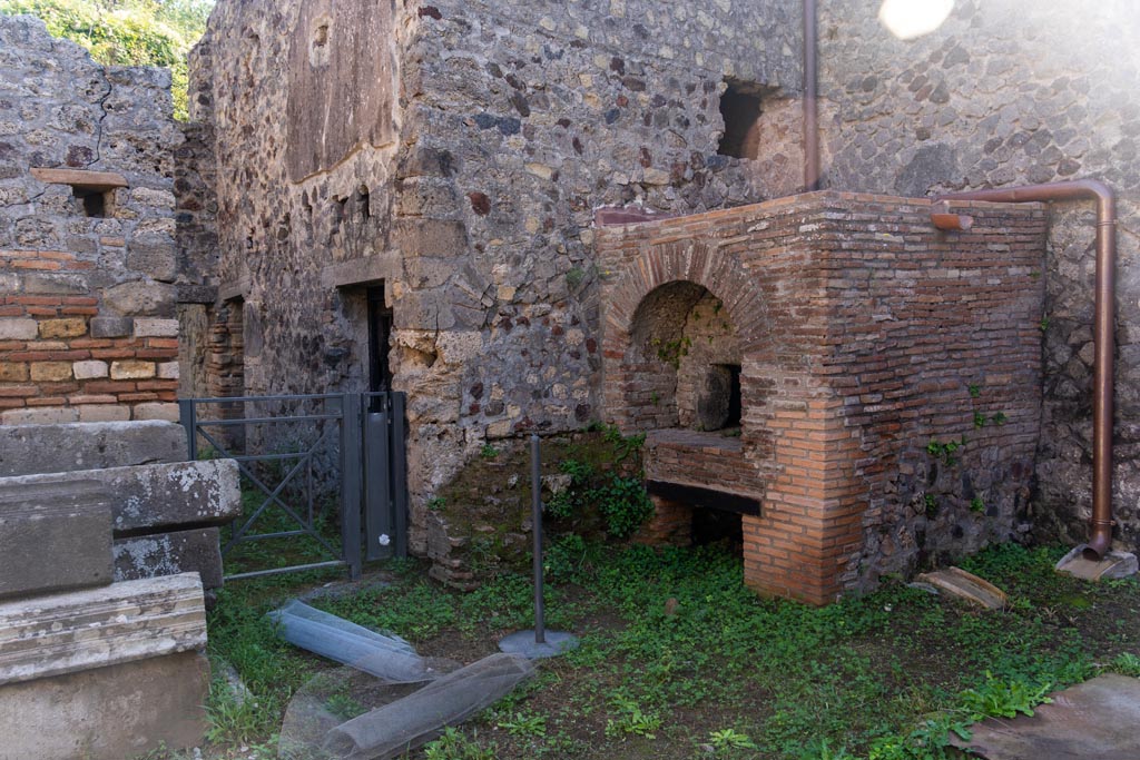 Villa of Mysteries, Pompeii. October 2023. 
Looking south-east towards oven in kitchen, and doorway to corridor 38. Photo courtesy of Johannes Eber.