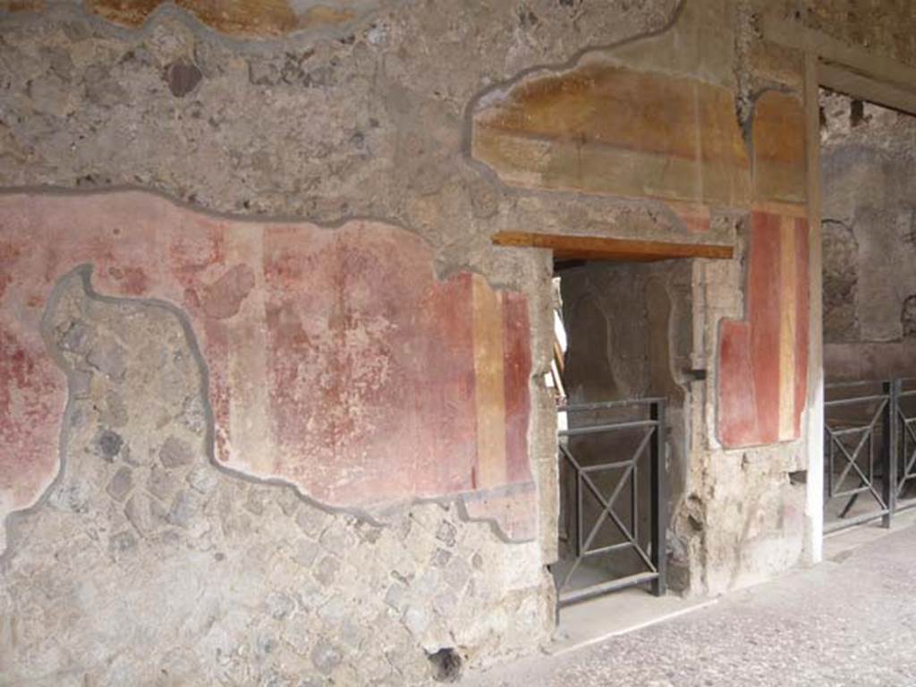 Villa of Mysteries, Pompeii. May 2012. Peristyle C, east wall. The first door on the left is to the unnumbered room next to room 66, on the right. Photo courtesy of Buzz Ferebee.