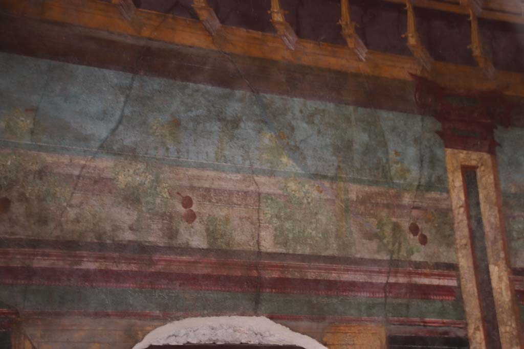 Villa of Mysteries, Pompeii. September 2021. 
Room 6, painted detail on west wall above doorway to corridor F1. Photo courtesy of Klaus Heese.
