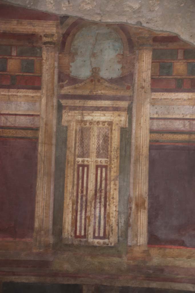 Villa of Mysteries, Pompeii. September 2021. 
Room 6, detail of painted doorway on north wall in oecus. Photo courtesy of Klaus Heese.