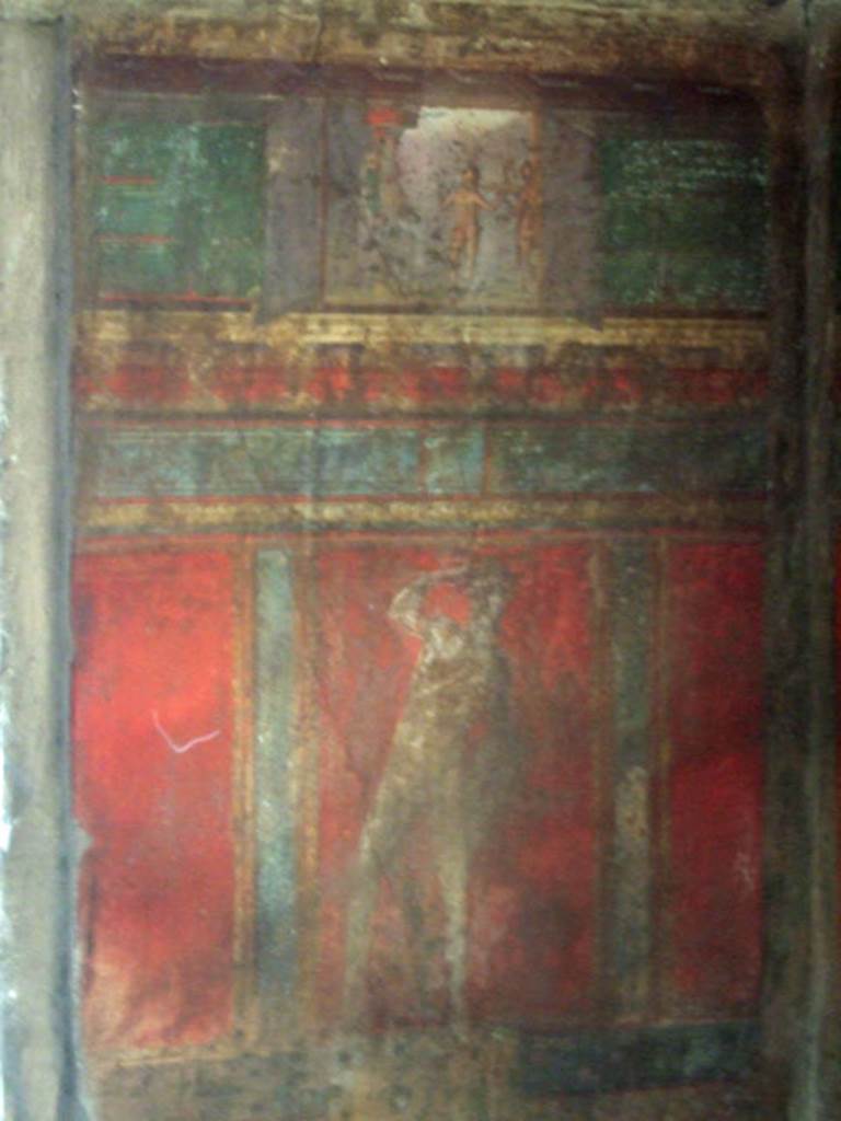 Pompeii. Villa of Mysteries. May 2006. Room 4, wall painting on west wall in north-west corner. The small upper panel shows a painting of a sacrifice.