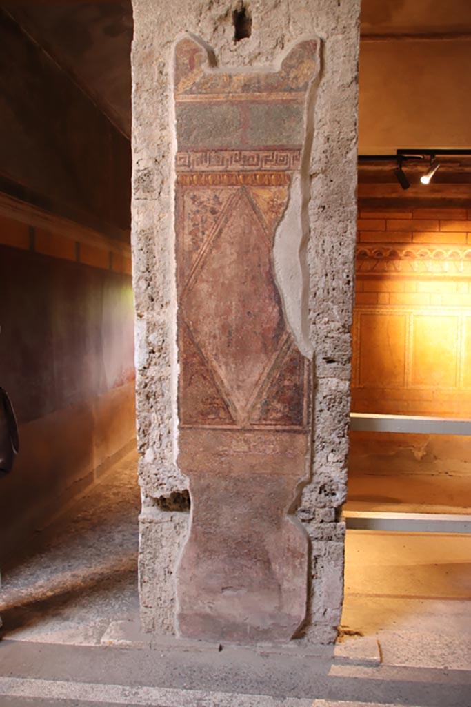 Villa of Mysteries, Pompeii. May 2024. 
Atrium (64), pilaster in south-west corner, with room (3) on right. Photo courtesy of Klaus Heese.