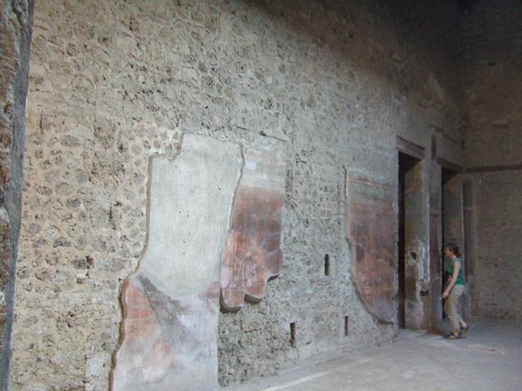 Villa of Mysteries, Pompeii. May 2006. Room 64, south wall with doorway to corridor F1.
For the east wall and east end of room 64, see next part (part 24).
.
