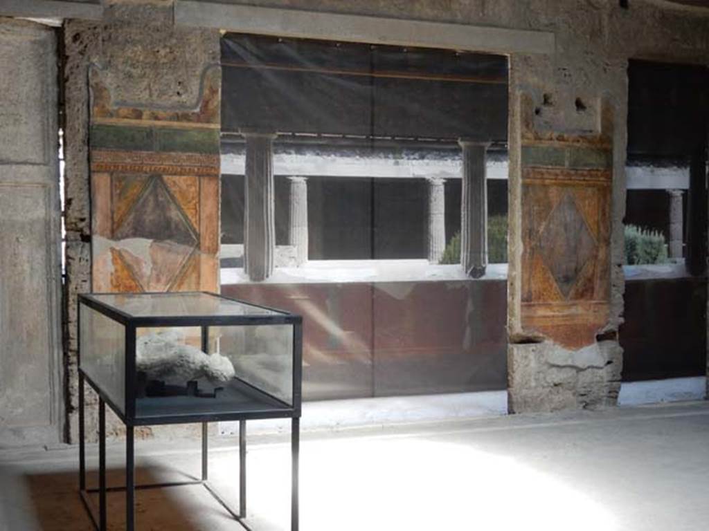 Villa of Mysteries, Pompeii. September 2015.  Room 64, looking east across atrium towards blinds with photo of peristyle A imprinted on it, across two of the entrance doorways. Photo courtesy of Buzz Ferebee.