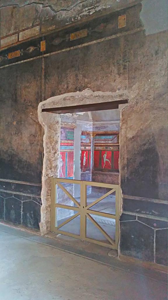 Villa of Mysteries, Pompeii. c.2015-2017. 
Room 2, tablinum, detail of south wall with doorway into room 4. Photo courtesy of Giuseppe Ciaramella.