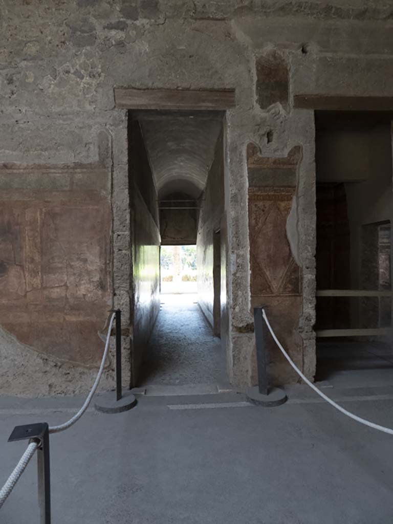 Villa of Mysteries, Pompeii. September 2017. 
Room 64, south wall with doorway to corridor F1, in centre, and room 3, on right.
Foto Annette Haug, ERC Grant 681269 DÉCOR.