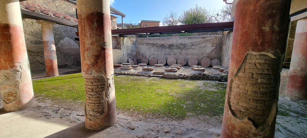 Villa Regina, Boscoreale. December 2023. 
Room I, cella vinaria, looking east towards dolia, from west portico. Photo courtesy of Miriam Colomer.