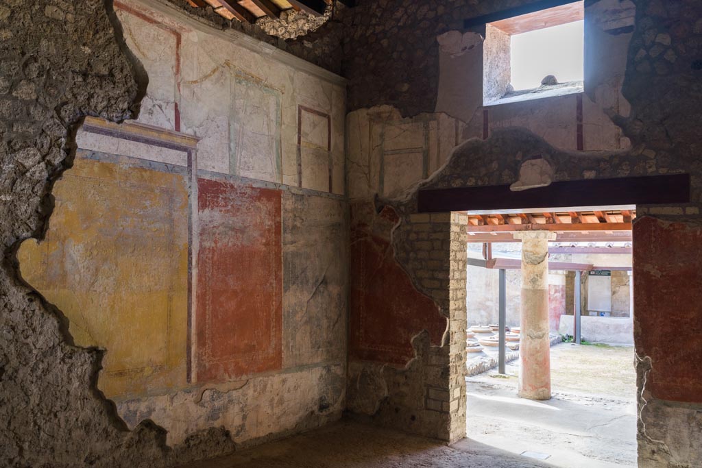 Villa Regina, Boscoreale. October 2021. 
Triclinium IV, looking towards east wall, south-east corner and south wall with doorway to portico VII.
Photo courtesy of Johannes Eber.