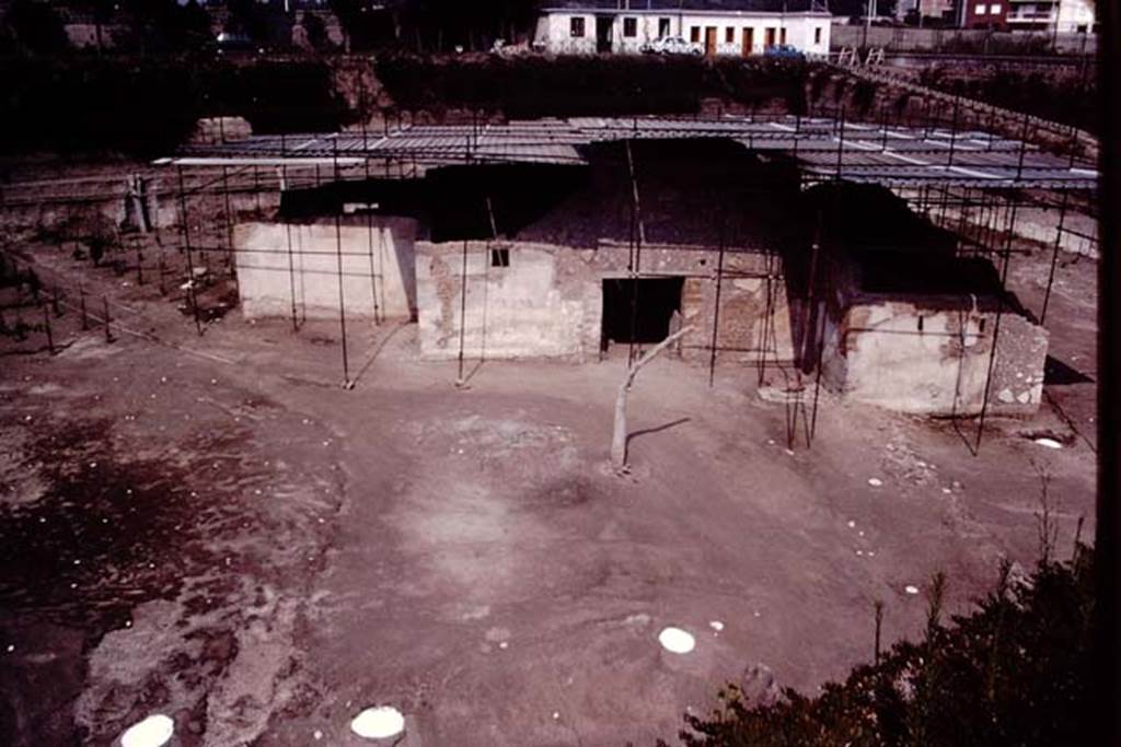 Villa Regina, Boscoreale. 1983. South side of villa with main entrance, with cast of tree in front.
The white tree root casts at the front border the country road that passed in front of the villa.
A roadway led from this to the front of the villa. 
A small country lane ran through the property and the path of this can be seen diagonally to the left.
See Jashemski, W. F., 1993. The Gardens of Pompeii, Volume II: Appendices. New York: Caratzas, p. 288, plan 128, figs. 316-7.
Source: The Wilhelmina and Stanley A. Jashemski archive in the University of Maryland Library, Special Collections (See collection page) and made available under the Creative Commons Attribution-Non Commercial License v.4. See Licence and use details.
J80f0600