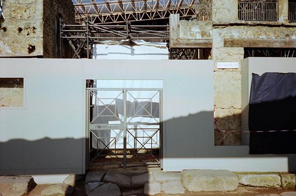 Unnamed vicolo between IX.11 and IX.12, behind the gates.  January 2010. North side. Photo courtesy of Rick Bauer.