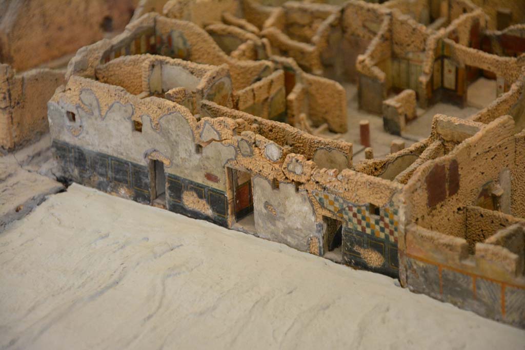 Unnamed vicolo, between IX.5 and IX.6, Pompeii. 2017. Detail from model in Naples Archaeological Museum.
Looking north to doorways at IX.5.19, IX.5.18, in centre, and IX.5.17, centre right.
On the left is the corner of the junction with Vicolo di Tesmo.
Foto Taylor Lauritsen, ERC Grant 681269 DÉCOR.