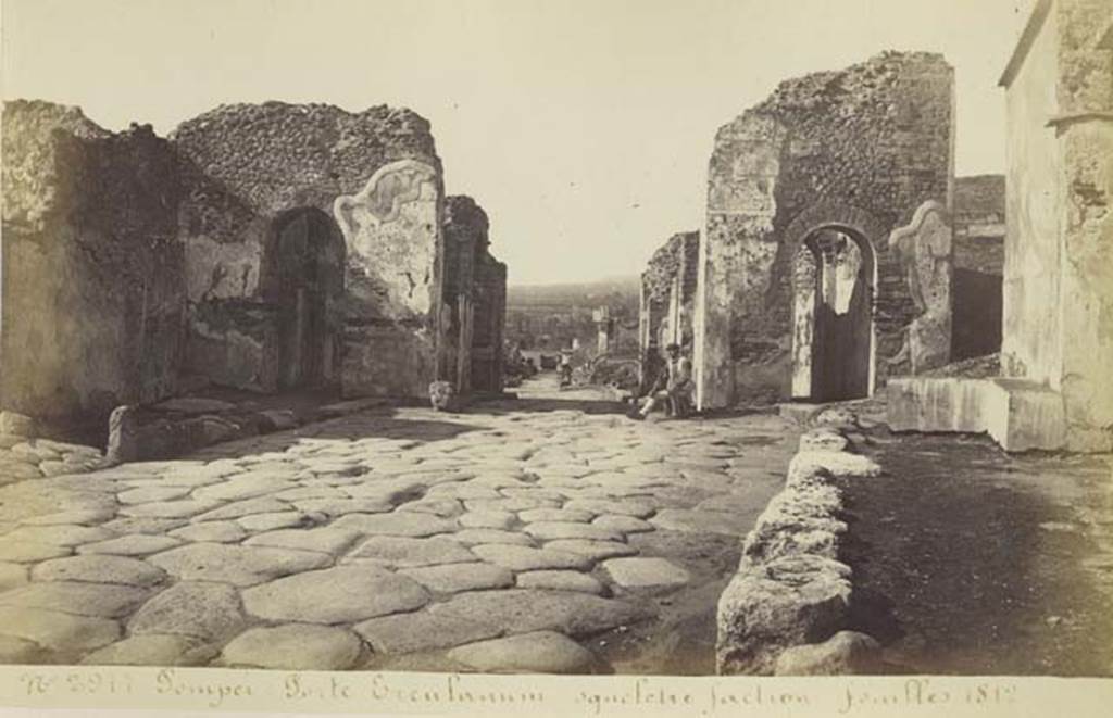 Via Consolare between VI.17 and VI.1. Old undated photograph by Amodio no. 2977, album dated c.1873. Looking north to Herculaneum Gate. Photo courtesy of Rick Bauer.