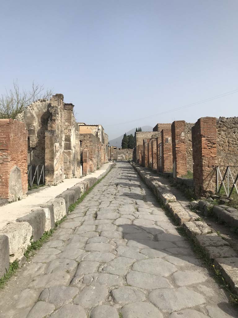 Via Consolare, Pompeii. April 2019. Looking north between VI.17.34/33, on left, and VI.3.10, on right. 
Photo courtesy of Rick Bauer.
