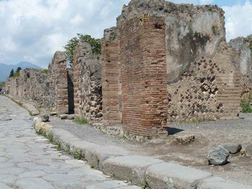 Via Consolare. May 2010. Looking north-east towards the junction with Vicolo di Modesto along the west side of VI.6 from near VI.6.20.
