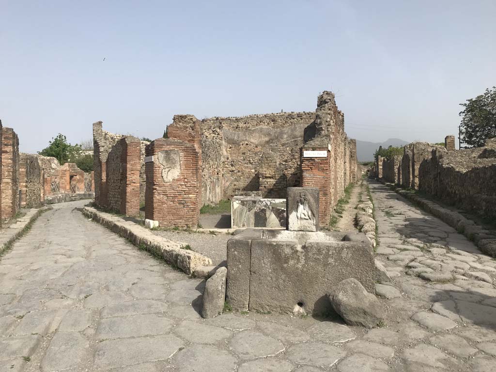 Via Consolare, Pompeii. April 2019. Looking towards junction with Vicolo di Modesto (on right). 
Photo courtesy of Rick Bauer.