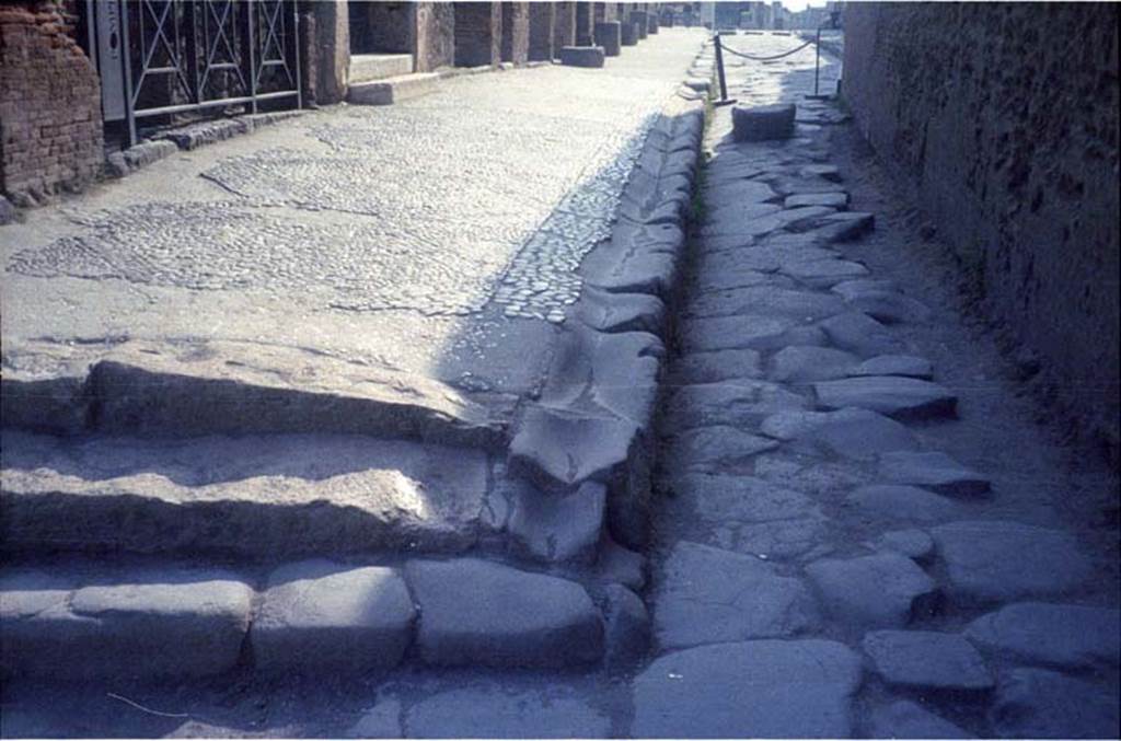 Via Marina with Vicolo del Gigante to the left (north). July 2011. Looking east to VII.7.12 on corner. Photo courtesy of Rick Bauer.